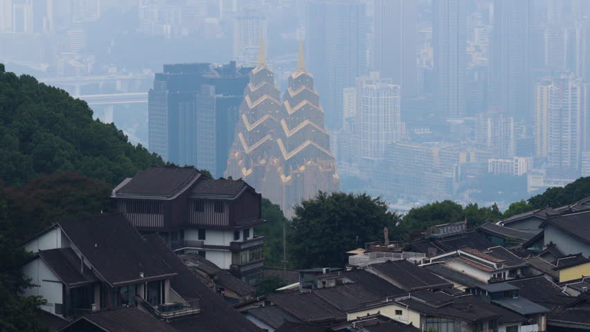Famous Golden Structures Of The Sheraton Chongqing Hotel View From Huangjueya Old Street In Chongqing, China. Aerial Shot