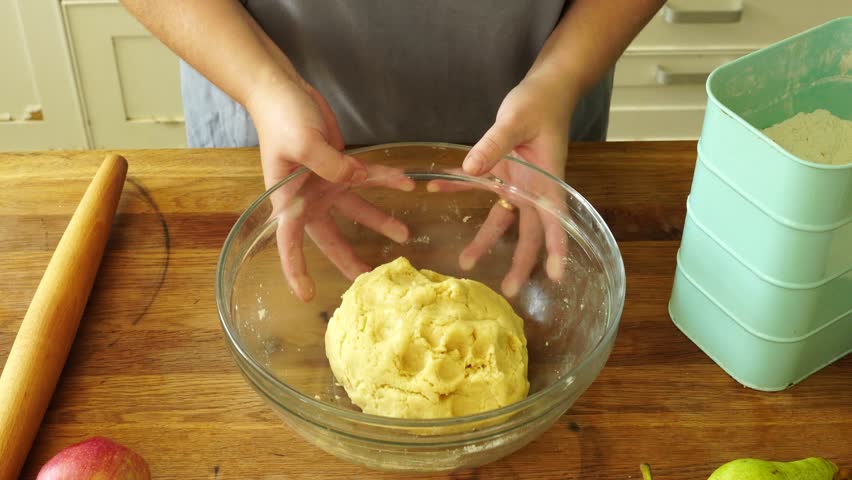 Woman makes an apple pie