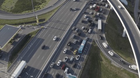 Drone Rotation over Highway toward City Skyline