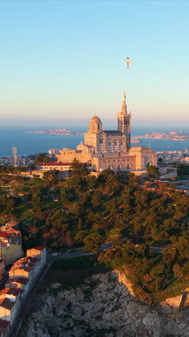 Vertical Aerial City Sunrise Scene, Morning Glow Over Marseille Port, Sunrise Bathes Lively Marseille Harbor In Light. France