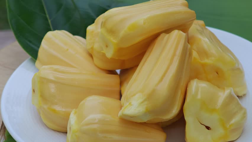 Jackfruit on a plate, peeled and ready to eat.	