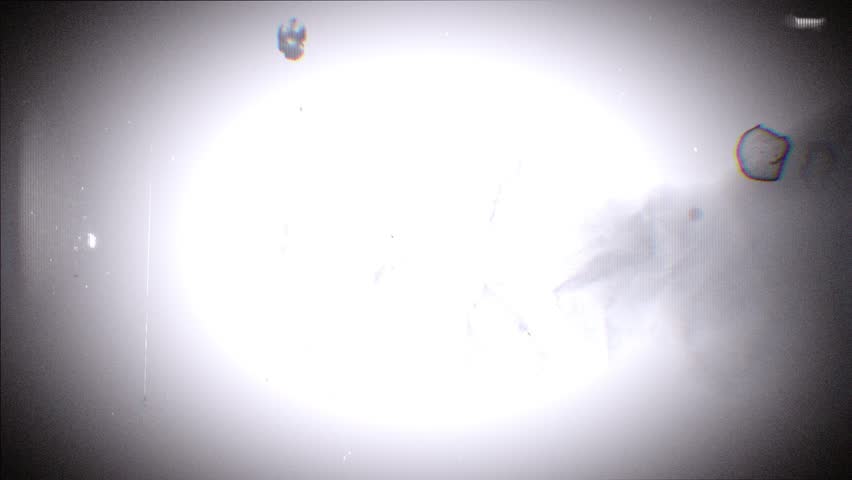 A looping background of stop motion style love grungy paper love hearts in a stylised negative film reel style.
