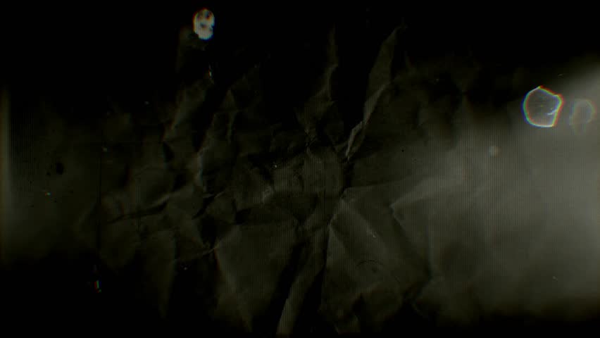 A looping background of stop motion style grungy paper love hearts in a stylised old vintage sepia film reel style.
