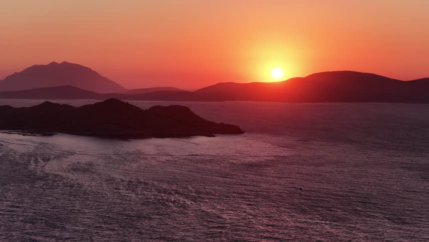 Sunset over Aegean Sea from Rodos Greece with mountains