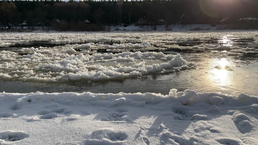 Close up view of ice floes drifting down the river when the weather is warming up