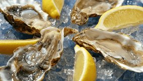 Fresh raw oysters with ice, french restaurant, mediterranean Healthy sea food, gourment luxury cuisine. Close up of seafood restaurant.  - Powered by Shutterstock - Get 15% off with code: PIKWIZARD15