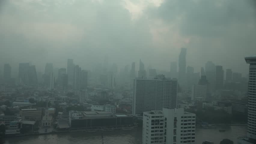 Cityscape of Bangkok covered by mixture of dust in air pollution. Heavy air pollution of fine particulate matter (PM2.5) in morning.