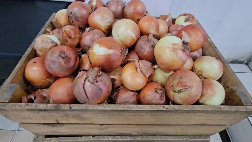This is a group of onions in a basket. 