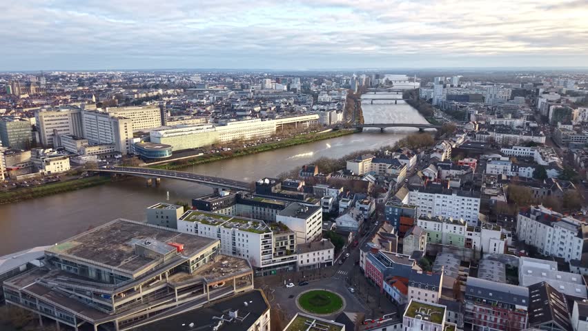 Drone aerial view of Nantes cityscape with the Loire River, Pont Haudaudine bridge and CHU Hôtel-Dieu hospital district in Nantes, Loire-Atlantique, Pays de la Loire region, western France