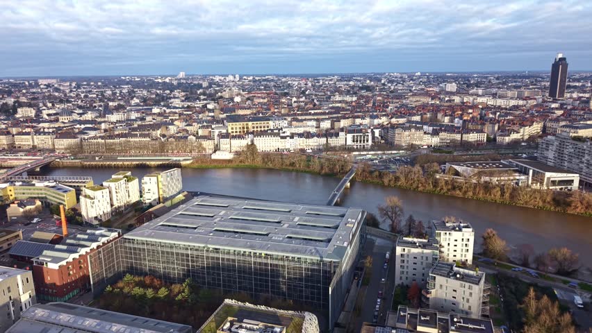 Drone aerial view of Nantes cityscape with Loire River, Palais de Justice de Nantes, Pont Haudaudine bridge and Tour de Bretagne tower in Nantes, Loire-Atlantique, Pays de la Loire region, France