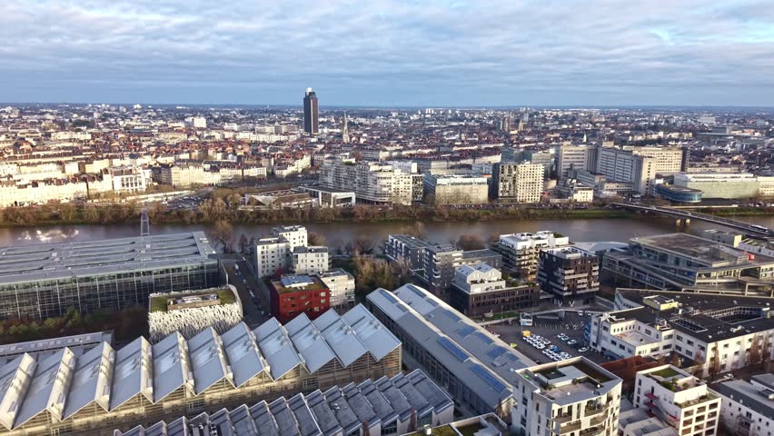 Drone aerial view of Nantes cityscape with Loire River, Pont Haudaudine bridge, CHU hospital district and Tour de Bretagne tower in Nantes, Loire-Atlantique, Pays de la Loire region, western France