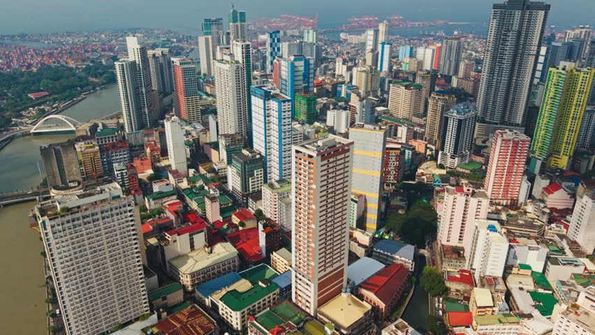 Vibrant skyline of Binondo Manila with sunlight reflecting on tall towers
