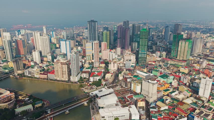 Aerial Establishing Shot Of Old Manila Binondo With River And Bridges