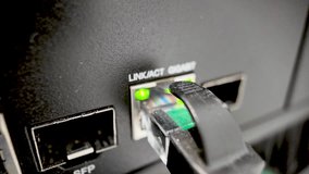 Macro Shot Of A Network Cable Plugged Into A Gigabit Ethernet Port On A Network Switch For Data Transfer And Connectivity Solutions. - Powered by Shutterstock - Get 15% off with code: PIKWIZARD15