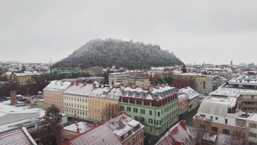 Scenic Winter Cityscape with Snowy Rooftops