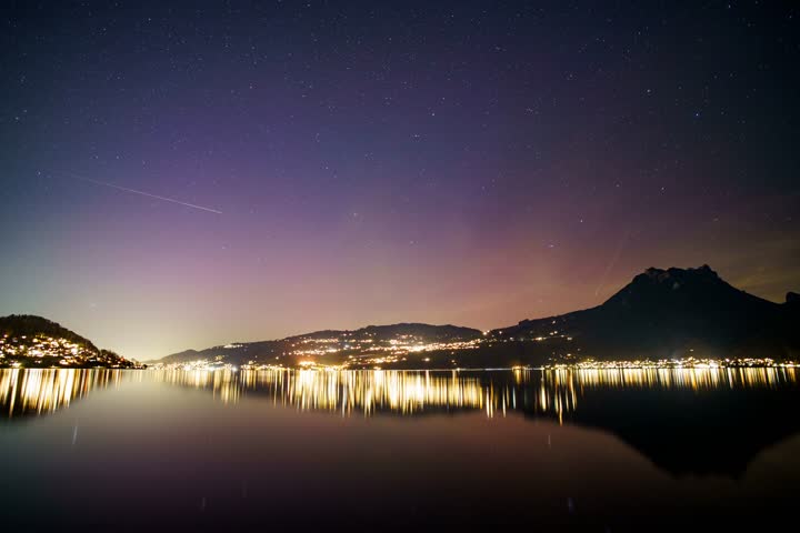 Nighttime Lake Reflection with Starry Sky.