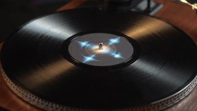 Close Up of Vinyl Record and Starting Playback on Turntable - Powered by Shutterstock - Get 15% off with code: PIKWIZARD15