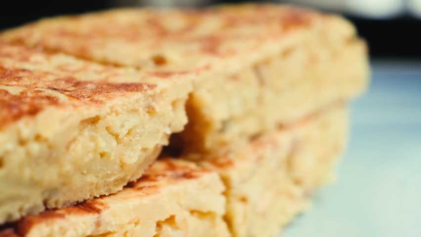 Spanish tortilla is a dish made from beaten and fried eggs, potatoes, and onions. It is a symbol of Spanish cuisine.