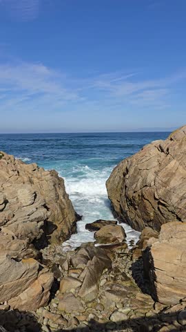 Majestic Ocean Waves Crashing on Rocky Shore.
