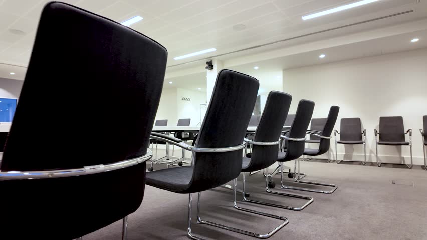 Corporate Boardroom Interior With Black Chairs And Conference Table For Business Meetings And Presentations Modern Office Space With Minimalist Designed.