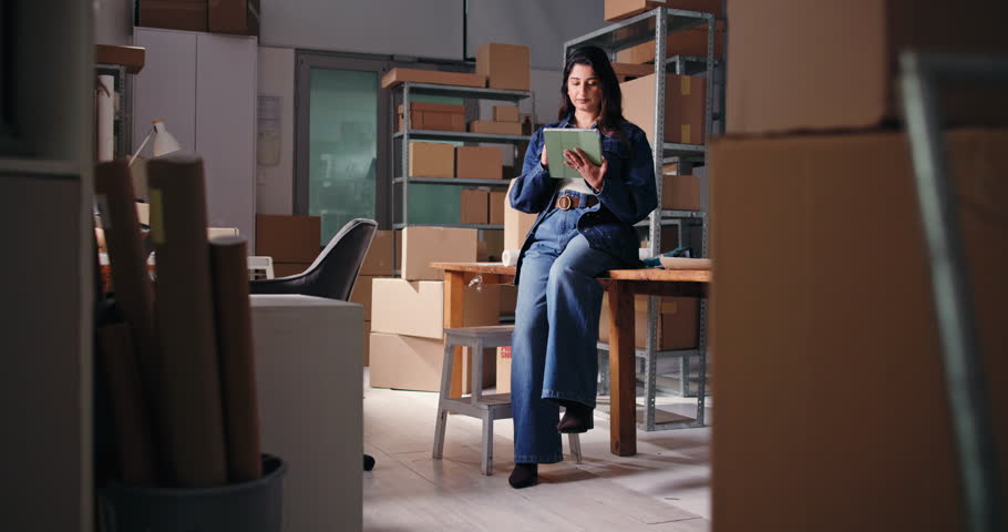 Ecommerce, tablet and smile with woman in warehouse for shipping, distribution or inventory manager. Delivery, supply chain or quality control with person in small business for online supplier email