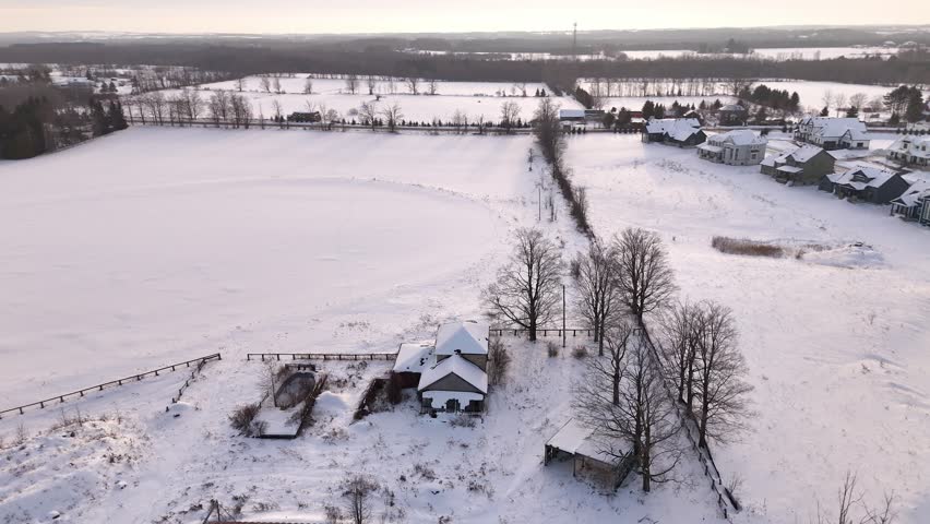 Abandoned Farm House during winter season. Snowy ladnscape in Ontario.