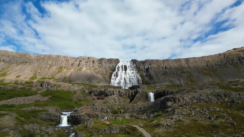 Breathtaking aerial view of the iconic Dynjandi waterfall in Iceland. Perfect for travel documentaries, nature conservation videos, and tourism promotions.