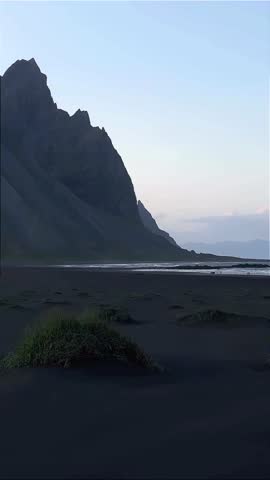 Dramatic Mountain Landscape Over Black Sand Beach at Dawn