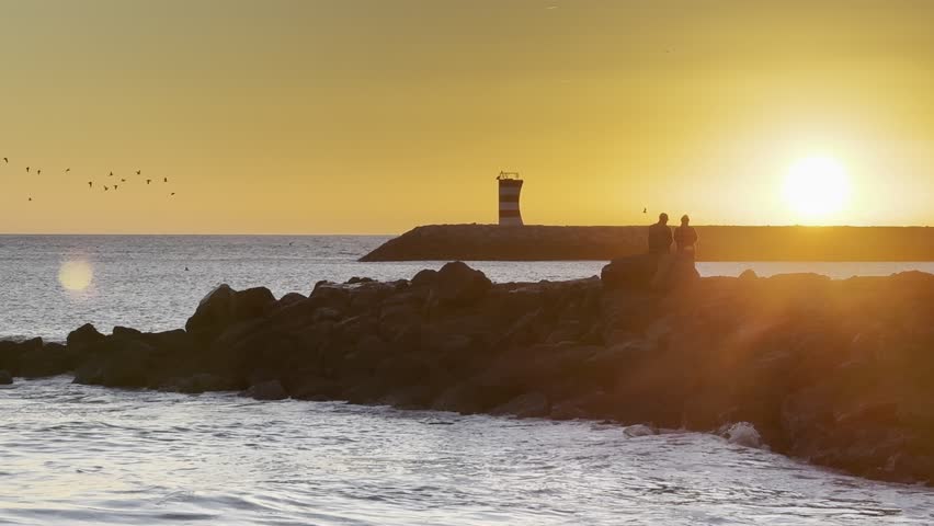 Beautiful sunrise dawn beach with waves, sand, sunrise sky gradually rising to the horizon. Seascape to relax the soul