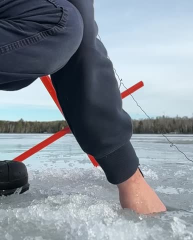 Ice fishing catching Largemouth Bass