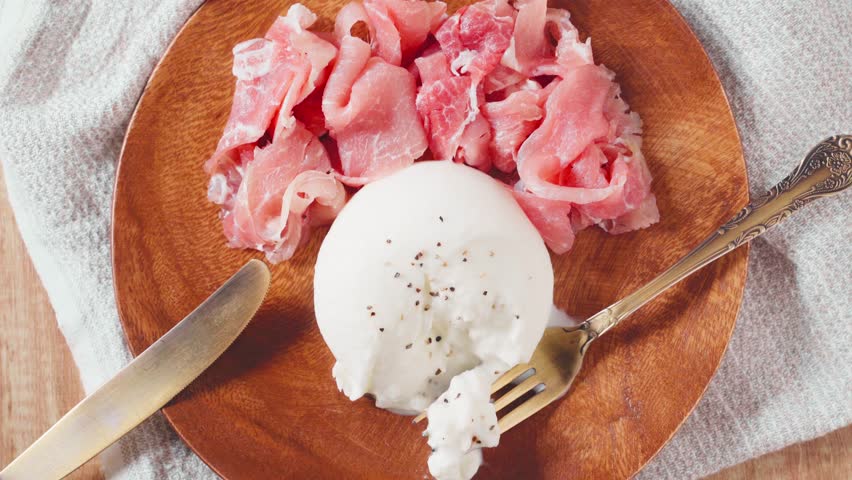 Burrata Cheese with Prosciutto on Wooden Plate