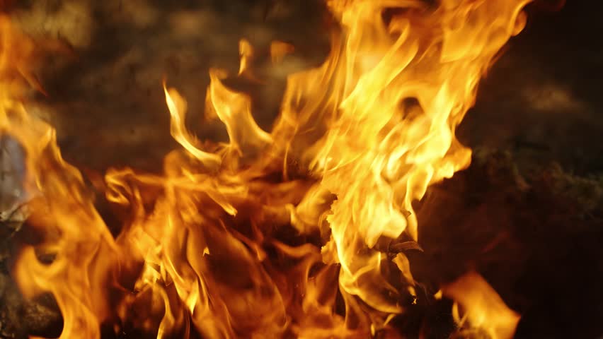 Large flames rise from sacred fire during Mayan ceremony