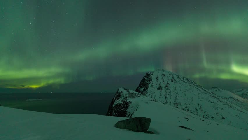 The Sea and Artic Cliffs Meet the Aurora Borealis, Timelapse