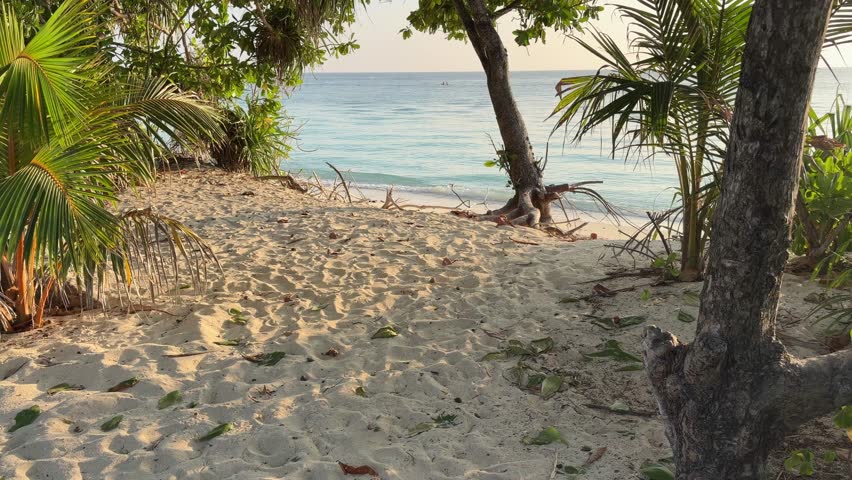 Ukulhas beach Maldives with white sand shoreline and calm turquoise ocean