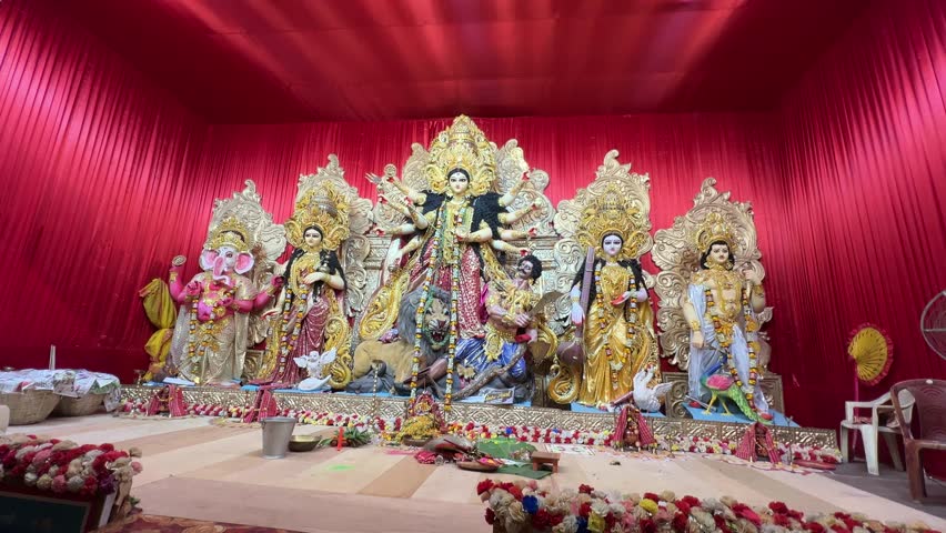 Ultrawide shot of Durga idol with red background Kolkata