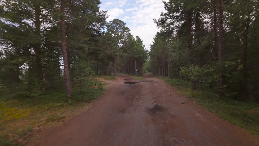 Flying Through Forest Dirt Roads In The Alta Region Of Norway. POV Shot