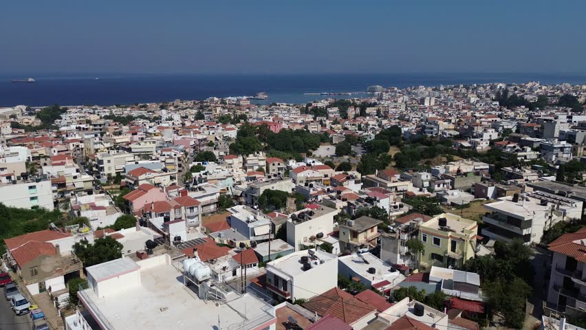Chios town, Chios island, Greece - July 24th, 2025 - footage of the the capital of the island, windmills, mosque, castle, harbor, cityscape, Aegean sea, apartment buildings, churches, Ottoman heritage and mountains behind