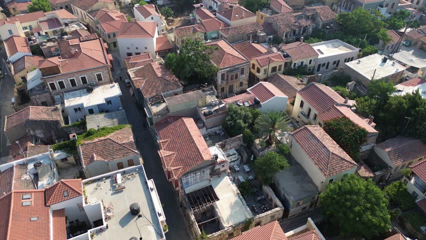 Chios town, Chios island, Greece - July 24th, 2025 - footage of the the capital of the island, windmills, mosque, castle, harbor, cityscape, Aegean sea, apartment buildings, churches, Ottoman heritage and mountains behind