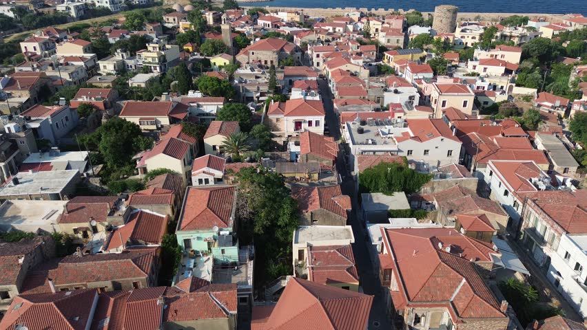 Chios town, Chios island, Greece - July 24th, 2025 - footage of the the capital of the island, windmills, mosque, castle, harbor, cityscape, Aegean sea, apartment buildings, churches, Ottoman heritage and mountains behind