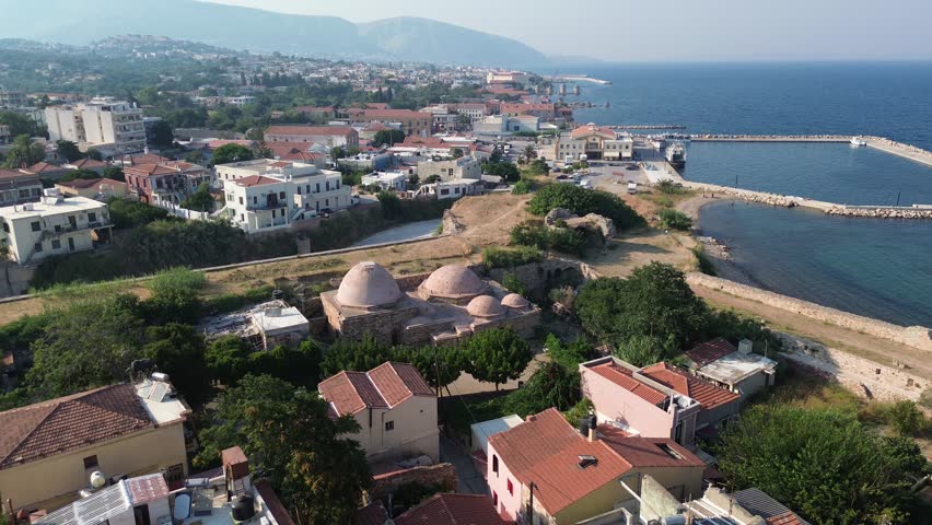 Chios town, Chios island, Greece - July 24th, 2025 - footage of the the capital of the island, windmills, mosque, castle, harbor, cityscape, Aegean sea, apartment buildings, churches, Ottoman heritage and mountains behind