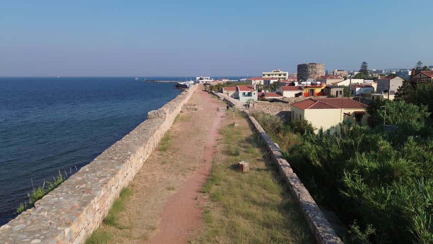 Chios town, Chios island, Greece - July 24th, 2025 - footage of the the capital of the island, windmills, mosque, castle, harbor, cityscape, Aegean sea, apartment buildings, churches, Ottoman heritage and mountains behind