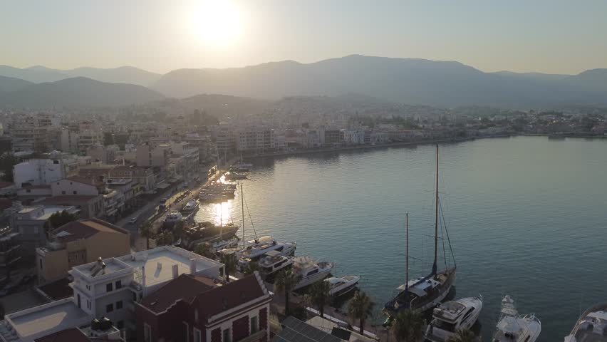 Chios town, Chios island, Greece - July 24th, 2025 - footage of the the capital of the island, windmills, mosque, castle, harbor, cityscape, Aegean sea, apartment buildings, churches, Ottoman heritage and mountains behind