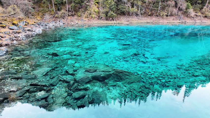 Scenery Jiuzhaigou national park in Sichuan, China. Beautiful Colorful Pond in Autumn season. Famous Landmark and Vacation near Chengdu, China. Asia travel concept 