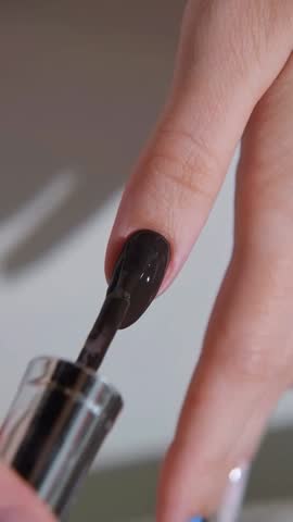 Close-Up of Young Woman Hands Applying Professional Modern Manicure, Elegant and Trendy Nail Art in Beauty Nail Salon
