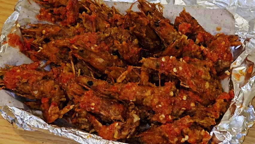 deep fried shrimps or prawns to a crispy texture, mixed with a spicy sauce and lemon, shrimps could be prepared in various cuisines, seafood concept