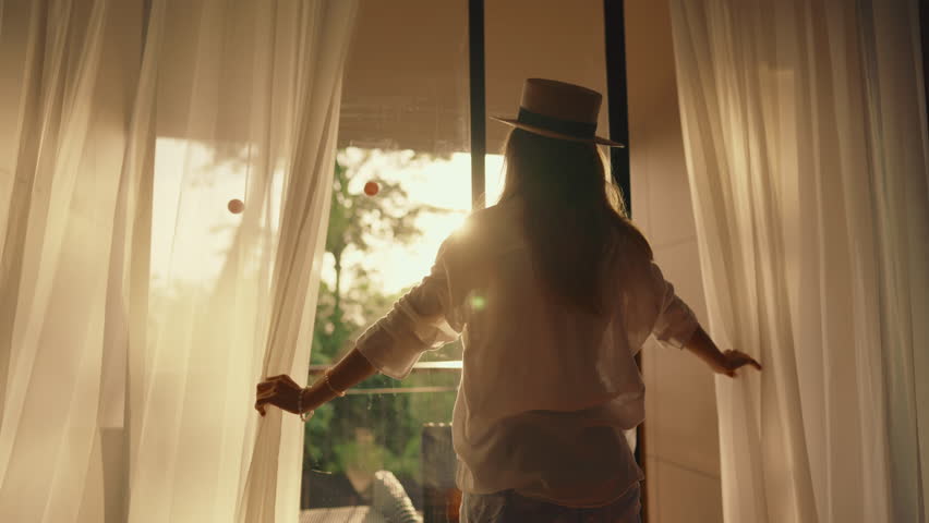 Sunrise Woman Silhouette, Backlit Woman Opening Curtains Amid Tropical Morning Scenery, Serene Early Morning Moment With Flowing Clothing And Golden Sunlight Filtering Through Sheer Curtains