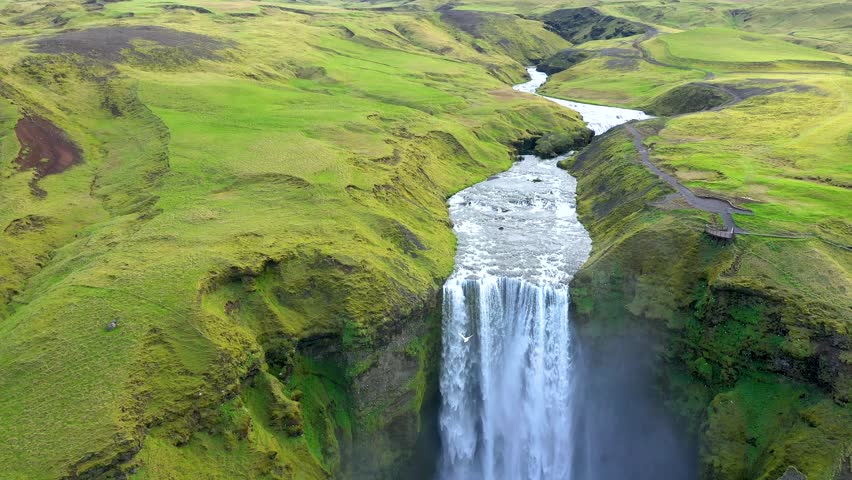 Aerial slow motion view of breathtaking Skogafoss waterfall, Iceland