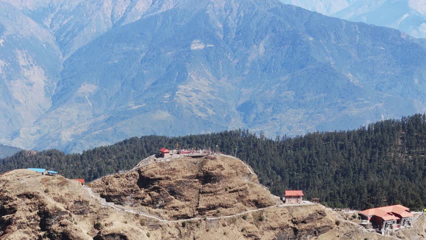 Aerial view of Kalinchowk Bhagawati Temple in Dolakha shows Himalayan mountains and green hills in Nepal