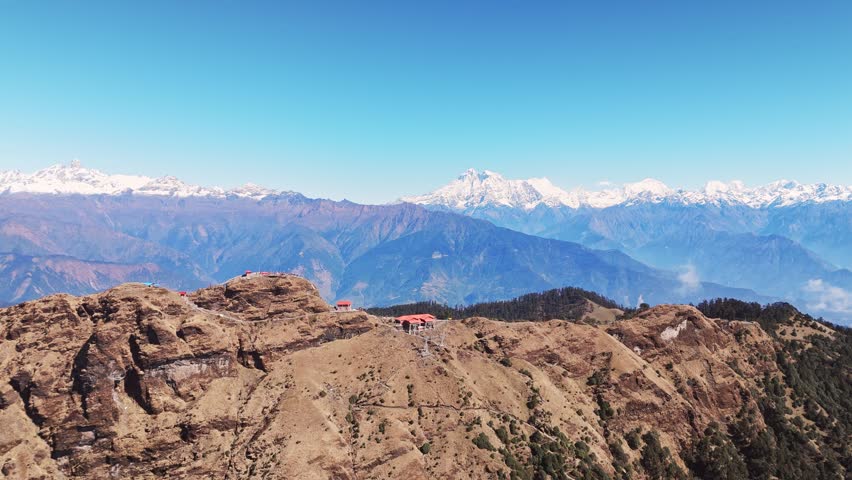 Aerial view of Kalinchowk Bhagawati Temple in Dolakha shows Himalayan mountains and green hills in Nepal
