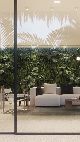The camera shows a modern living area with a white sofa, wooden table, and indoor plants. Sunlight comes through large windows, highlighting the greenery and furniture arrangement.